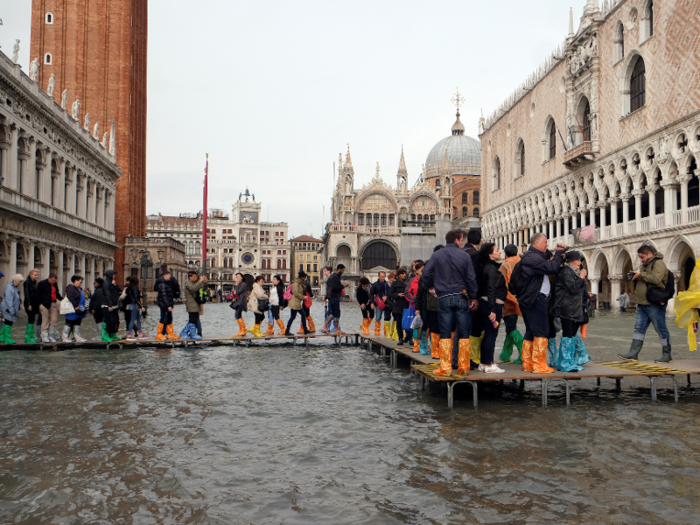 But sometimes these walkways are barely high enough to stay above the rising waters.