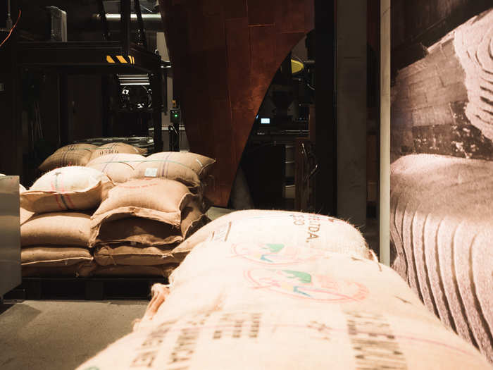 Near the plants is a window where customers can peek in and see where the coffee beans are shipped, before they are roasted or sent throughout the store.