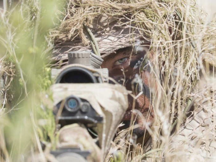 An Idaho Army National Guard sniper, from the 116th Calvary Brigade Combat Team, practices his skills during the platoon