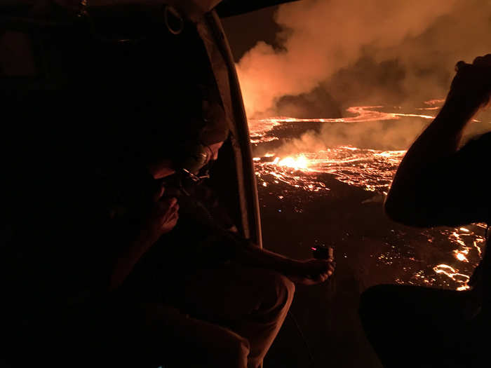 Members of the Hawaii National Guard monitor the flow of lava as it nears a geothermal power plant early Tuesday morning, May 22, 2018.