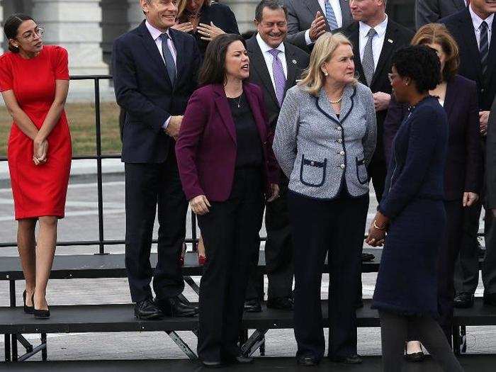 Alexandria Ocasio-Cortez joins with other incoming members of the House of Representatives for an official class photo of new House members. Ocasio-Cortez is one of the over 219 Democrats who won House seats during this year