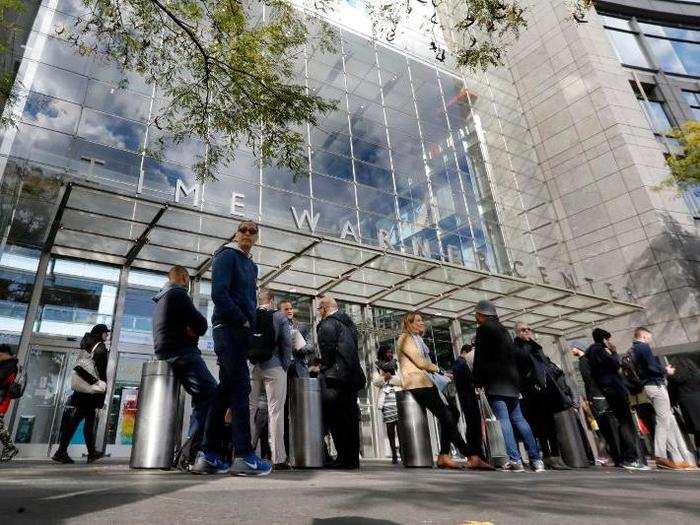 People gather outside the Time Warner Center after a police bomb squad evacuated CNN