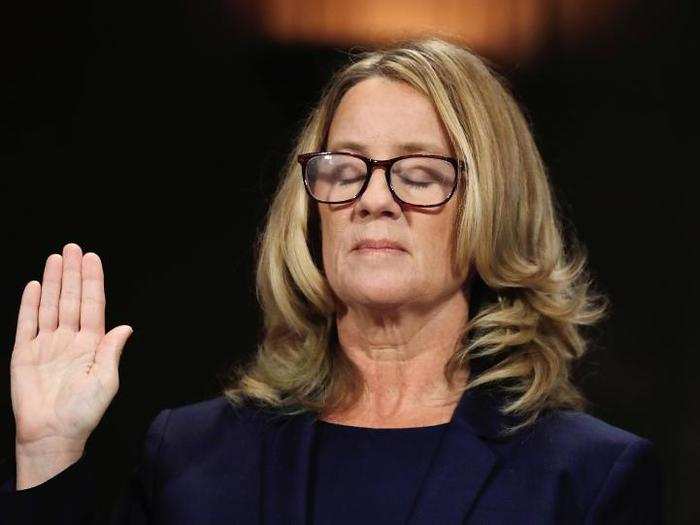 Christine Blasey Ford closes her eyes as she is sworn in before testifying to the Senate Judiciary Committee confirmation hearing for President Donald Trump