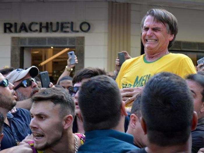 Brazilian presidential candidate Jair Bolsonaro reacts after being stabbed during a rally in Juiz de Fora. Bolsonaro, regarded as "Brazil