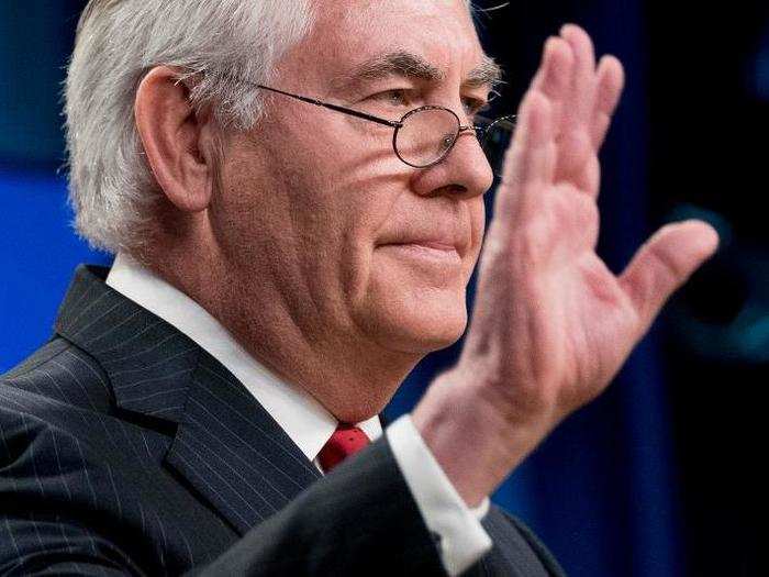 Secretary of State Rex Tillerson waves goodbye after speaking at the State Department the day President Donald Trump fired him in a major staff reshuffle.