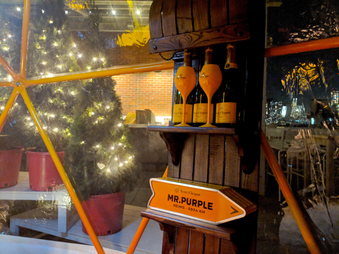 The pop-up heavily highlighted the partnership with Veuve Clicquot, with bottles perched on a shelf designed to look like a toboggan. (Or is it a toboggan designed to look like a shelf?)