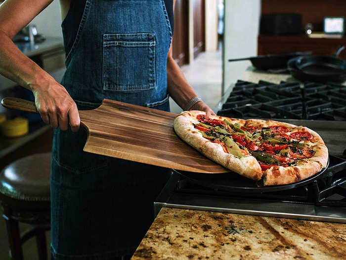 A pizza stone and cutter