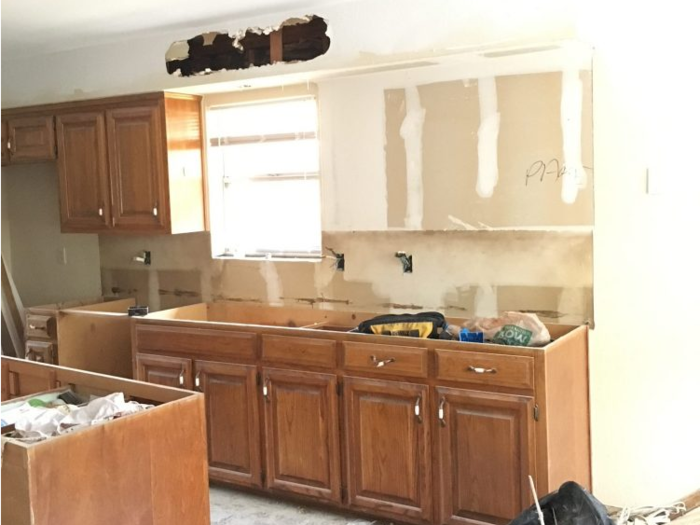 This was after they asked the contractor to do work for layout options they later discarded — like taking down the upper cabinets for open shelving. The cabinets later came back up after Griffis felt it looked lopsided.