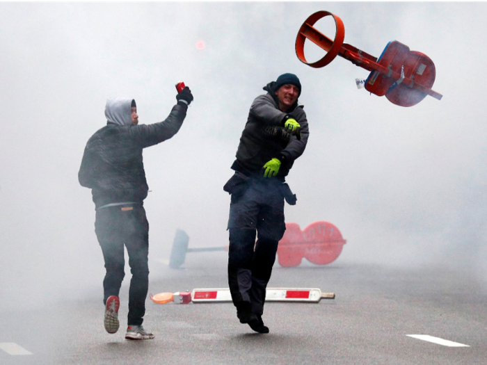 This man launched a traffic sign at law enforcement.