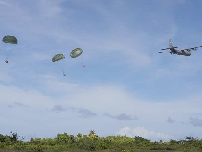 US military C-130J Super Hercules aircrews conduct low-cost, low-altitude drops, with parachuted packages touching down on land or at sea, the latter sometimes being necessary to avoid unintended damage to the environment or property.