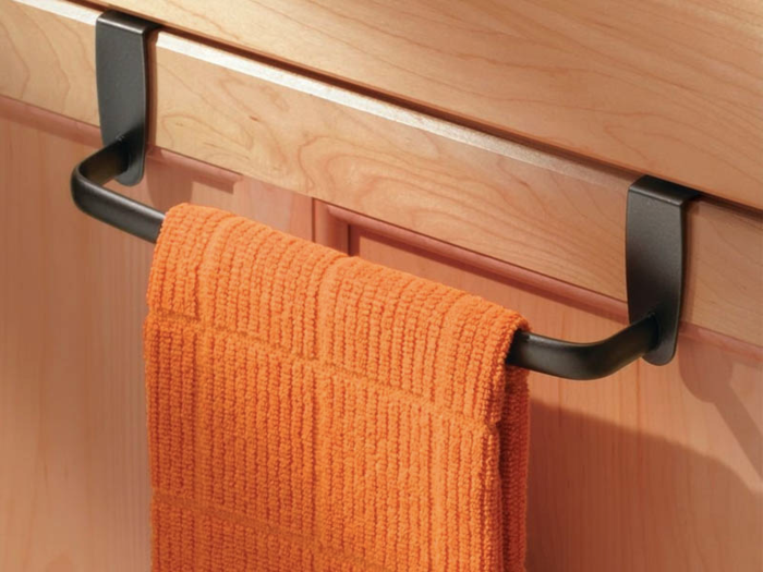 An over-the-cabinet towel bar
