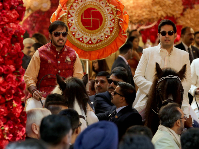 Brothers Akash and Anant rode in on horseback.