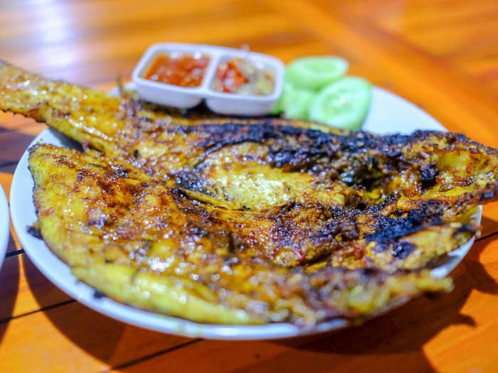 The dish is called Ikan Bakar, which translates literally to "burned fish." The idea is to make the charcoal flames burn a char on the skin. It was the freshest and tastiest fish I