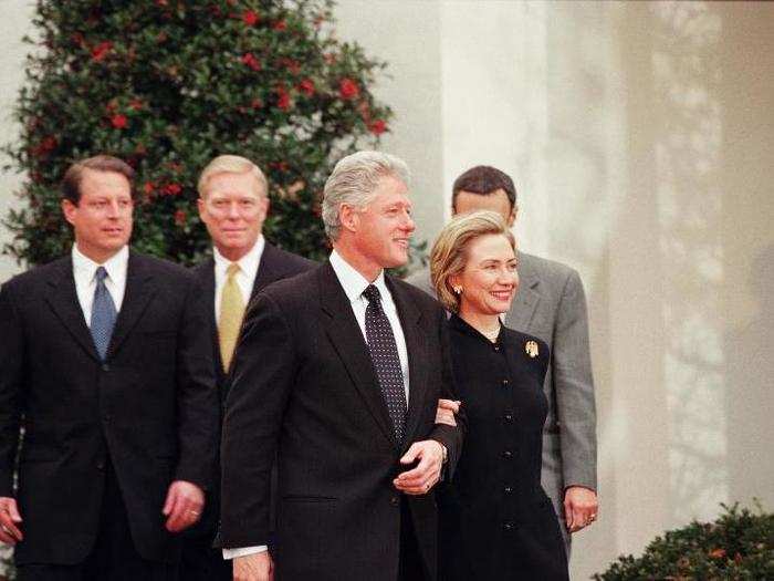 Despite the outcome of the vote, the Clintons smiled as they met members of the press outside the White House.