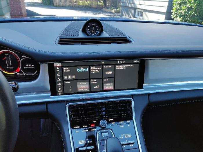 The center stack is dominated by a massive 12-inch touchscreen infotainment display.