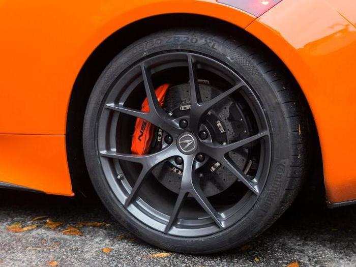 These blacked-out Y-spoke wheels are actually standard. The carbon-ceramic brake rotors and fat orange calipers ... not so much. They