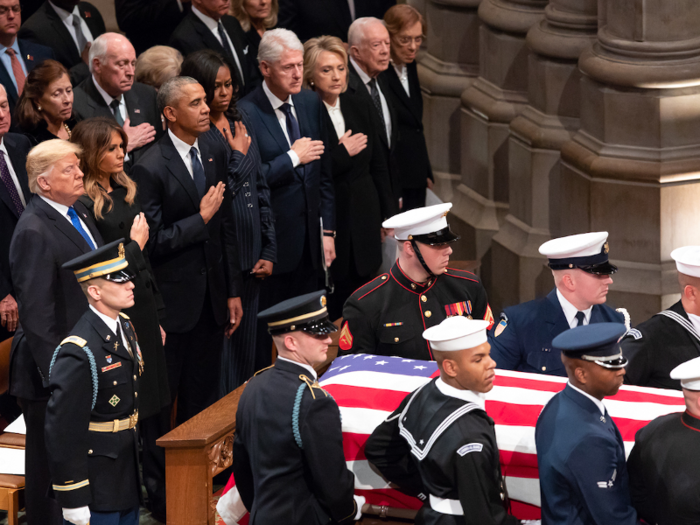 Dec. 5, 2018: The Trumps stand beside three former presidents and first ladies as the casket of former President George H. W. Bush arrives to the funeral service at the Washington National Cathedral in Washington, DC.