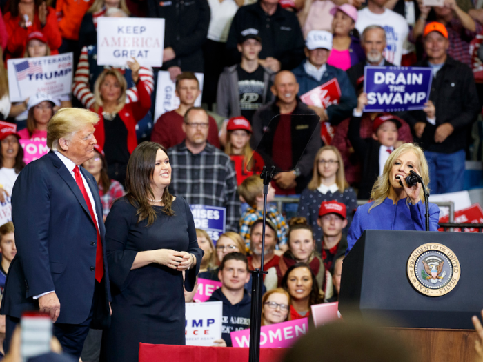 Nov. 5, 2018: Trump stands with Sarah Huckabee Sanders as Kellyanne Conway speaks at a rally in Fort Wayne, Indiana.