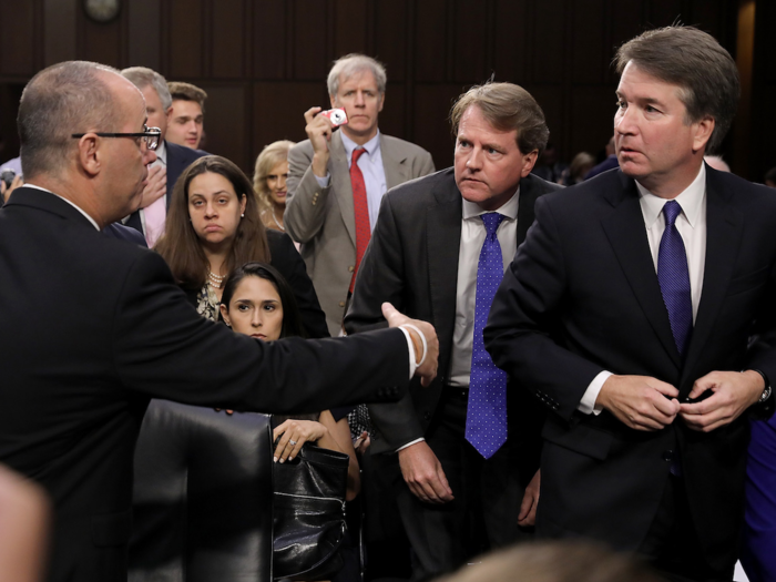 Sept. 4, 2018: Fred Guttenberg (L), father of murdered Marjory Stoneman Douglas High School student Jamie Guttenberg, tries to shake the hand of Supreme Court nominee Judge Brett Kavanaugh as Kavanaugh appeared before the Senate Judiciary Committee during his Supreme Court confirmation hearing.