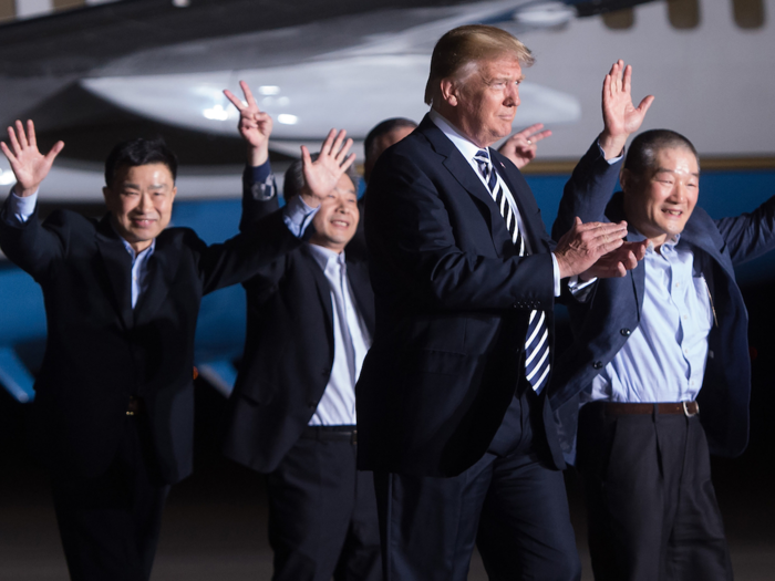 May 10, 2018: Trump walks with US detainees Tony Kim (L), Kim Hak-song (2nd L) and Kim Dong-chul (R) upon their return after they were released by North Korea, at Joint Base Andrews in Maryland.