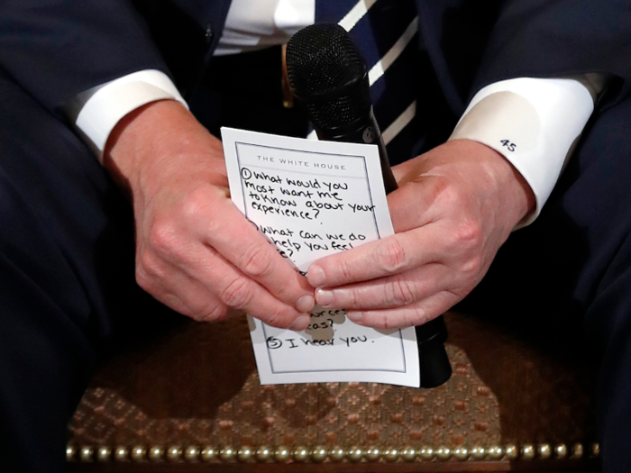 Feb. 21, 2018: Trump holds notes during a listening session on school shootings with high school students and teachers at the White House.