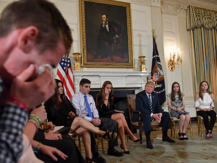 Feb. 21, 2018: Samuel Zeif, student at Marjory Stoneman Douglas High School, left, weeps after recounting his story of the shooting incident at his high school as Trump, students, and teachers look on at a White House listening session on school shootings.