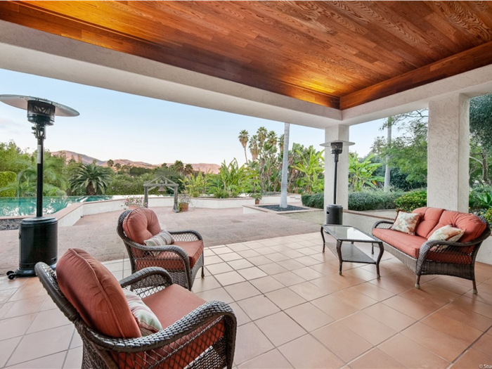 A covered patio overlooks the 25-meter, vanishing-view pool ...