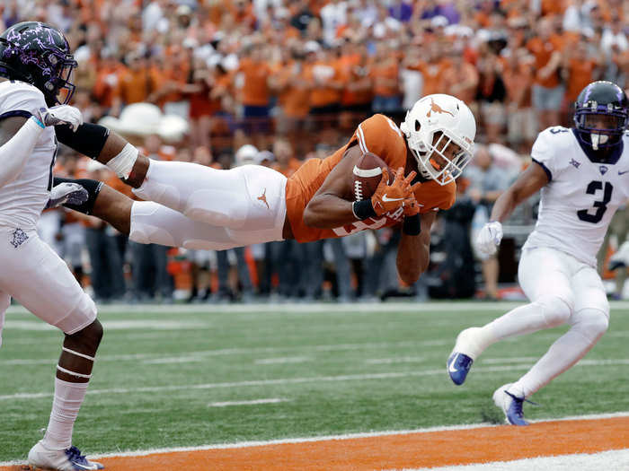 Texas Longhorns wide receiver Collin Johnson goes horizontal for the score.