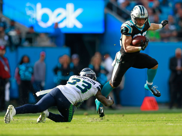 Carolina Panthers running back Christian McCaffrey sidesteps Seattle Seahawks