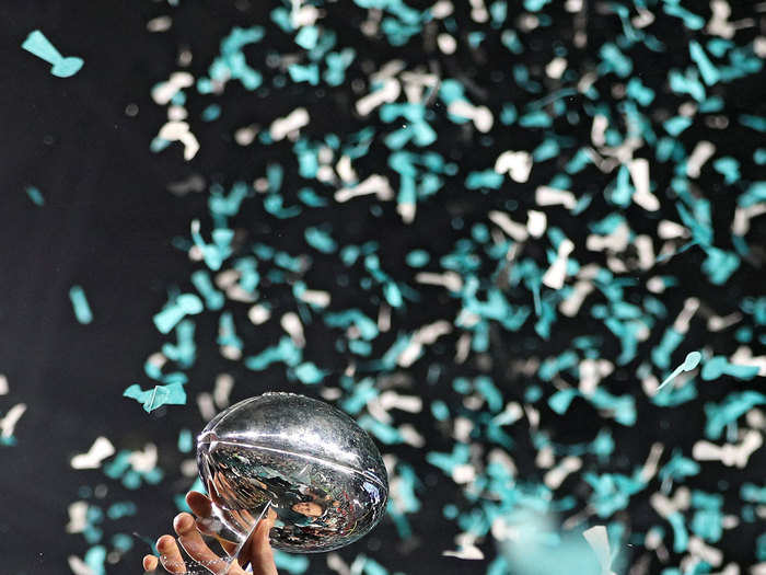 Eagles backup quarterback Nick Foles hoists the Lombardi Trophy in the air after defeating the New England Patriots in Super Bowl LII.