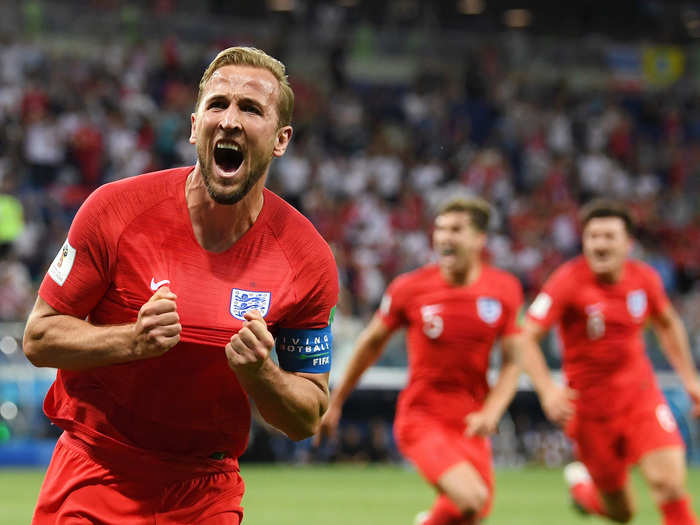 Harry Kane celebrates after bringing England back from the brink.