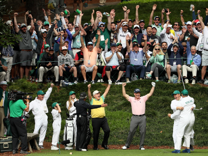 Jack Nicklaus celebrates his grandson Gary, who hit the first hole-in-one of his life while caddying for his grandfather at the Masters Par 3 contest.