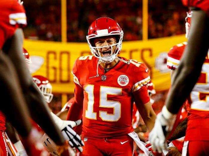 Kansas City Chiefs quarterback Patrick Mahomes takes the field with a little help from his teammates.