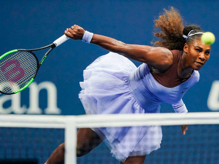 Serena Williams slams the ball over the net during the Women