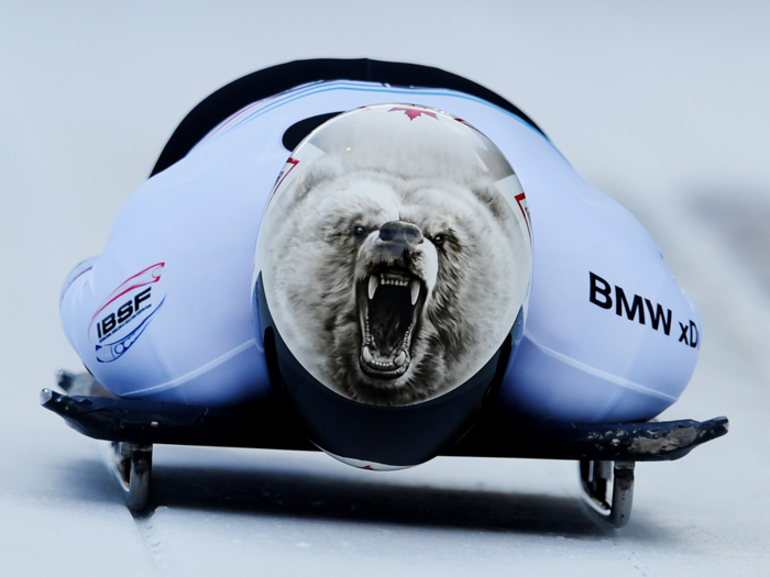 Barrett Martineau of Canada rides ferociously down the track on his sled.