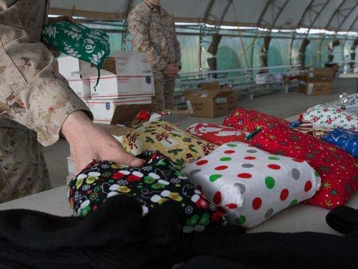 Troops are celebrating Christmas from undisclosed locations in the Middle East, where care packages are sent to boost morale.