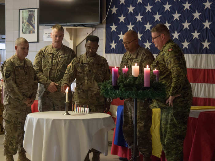 In Romania, international troops celebrated together with a candle lighting ceremony.