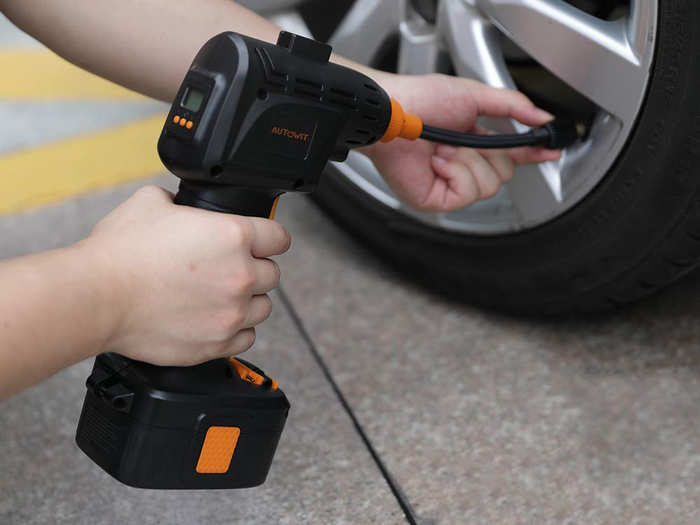 A cordless tire inflator