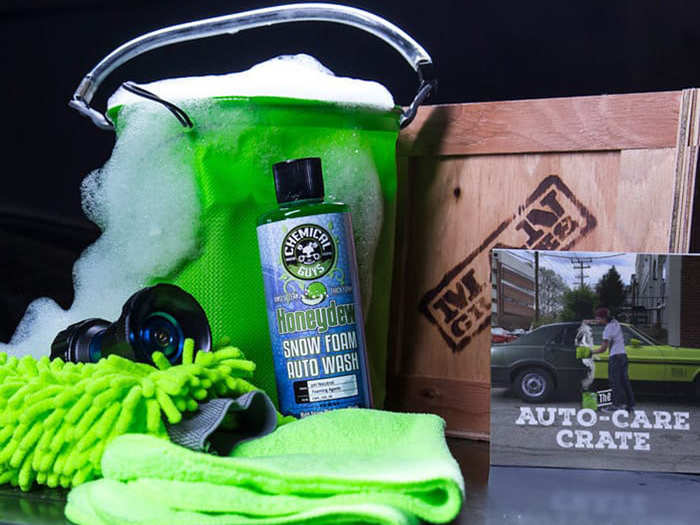 A wooden gift crate filled with auto-care products