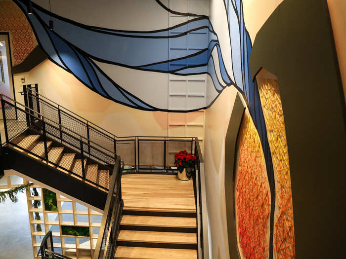 The stairwell has another little secret, too: The mural on the walls was actually painted by three different artists, none of whom had ever worked together before. The idea, says Russell, was to get across that notion of teamwork in a subtle way.