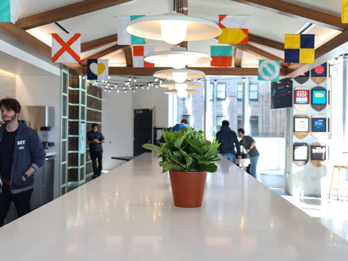 Russell says that the office is very big on greenery and natural light — two things that were missing from the old, cavernous warehouse space, she says. The flags are abstract representations of Atlassian