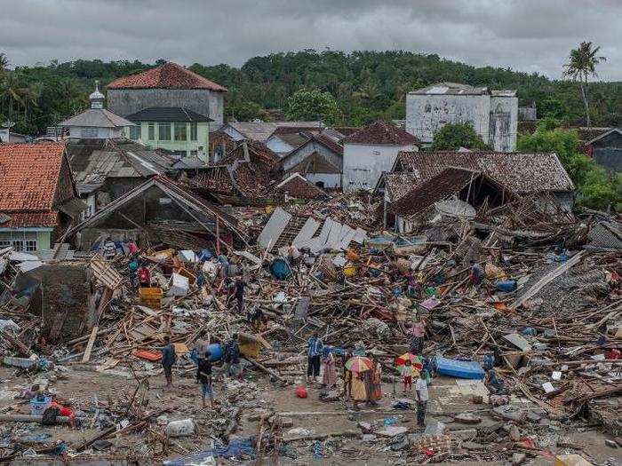 The waves hit the Sunda Strait without warning, crashing into the country