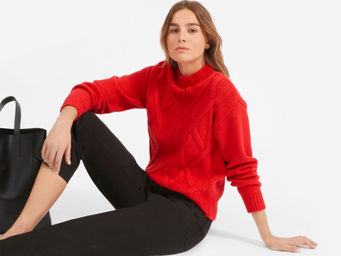 A bright red cable-knit wool sweater