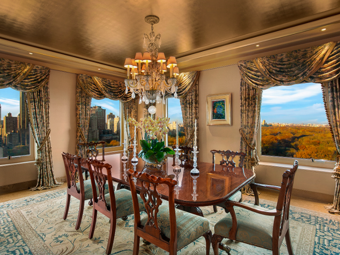 The formal dining room occupies one corner of the floor, allowing for panoramic views of the park and Manhattan