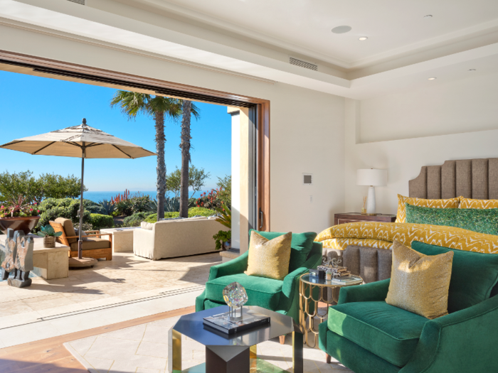 One entire wall of this bedroom opens up for access to the outdoor space.