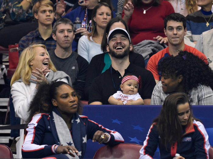 She and her dad sit in the bleachers to watch Serena crush her competition on the court.