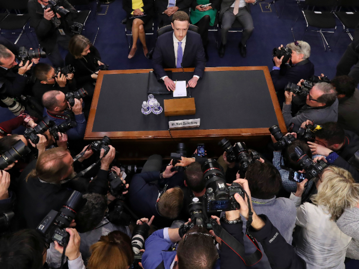 APRIL: Facebook CEO Mark Zuckerberg stares down a scrum of the world