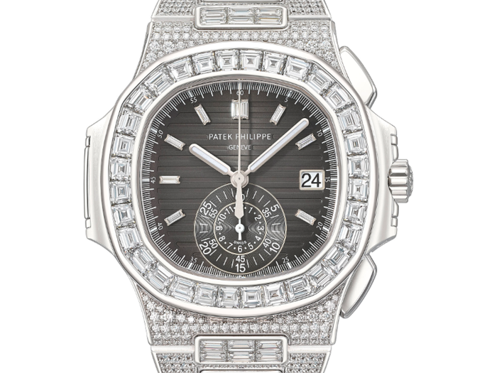 9. A unique Patek Philippe chronograph wristwatch, 18k white gold and diamond-set with a degradé black dial, brought in $614,766.