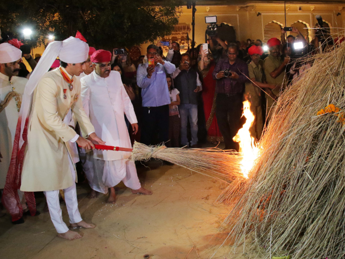 Singh lit a bonfire at the City Palace in Jaipur for Holi this year.