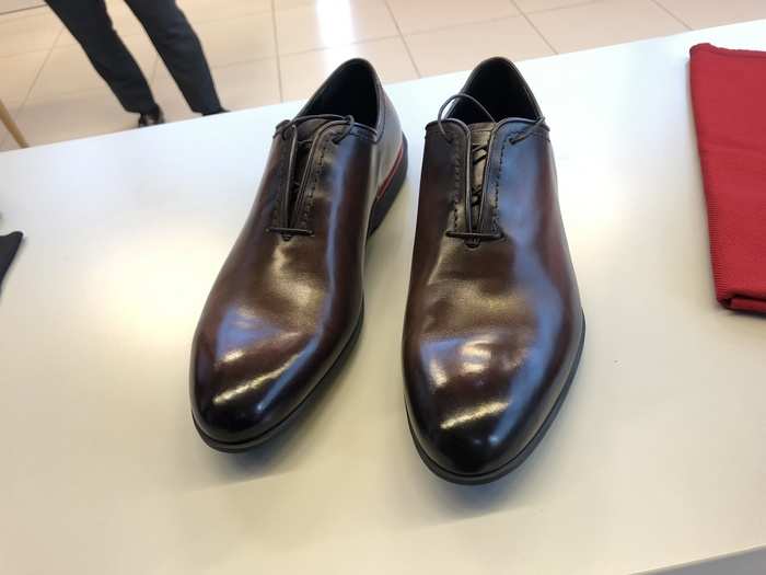 A lovely pair of dress shoes, for example. These "brun" Berluti oxfords are made of "Venezia leather and features hidden laces and red piping on the heel," according to Ferrari.